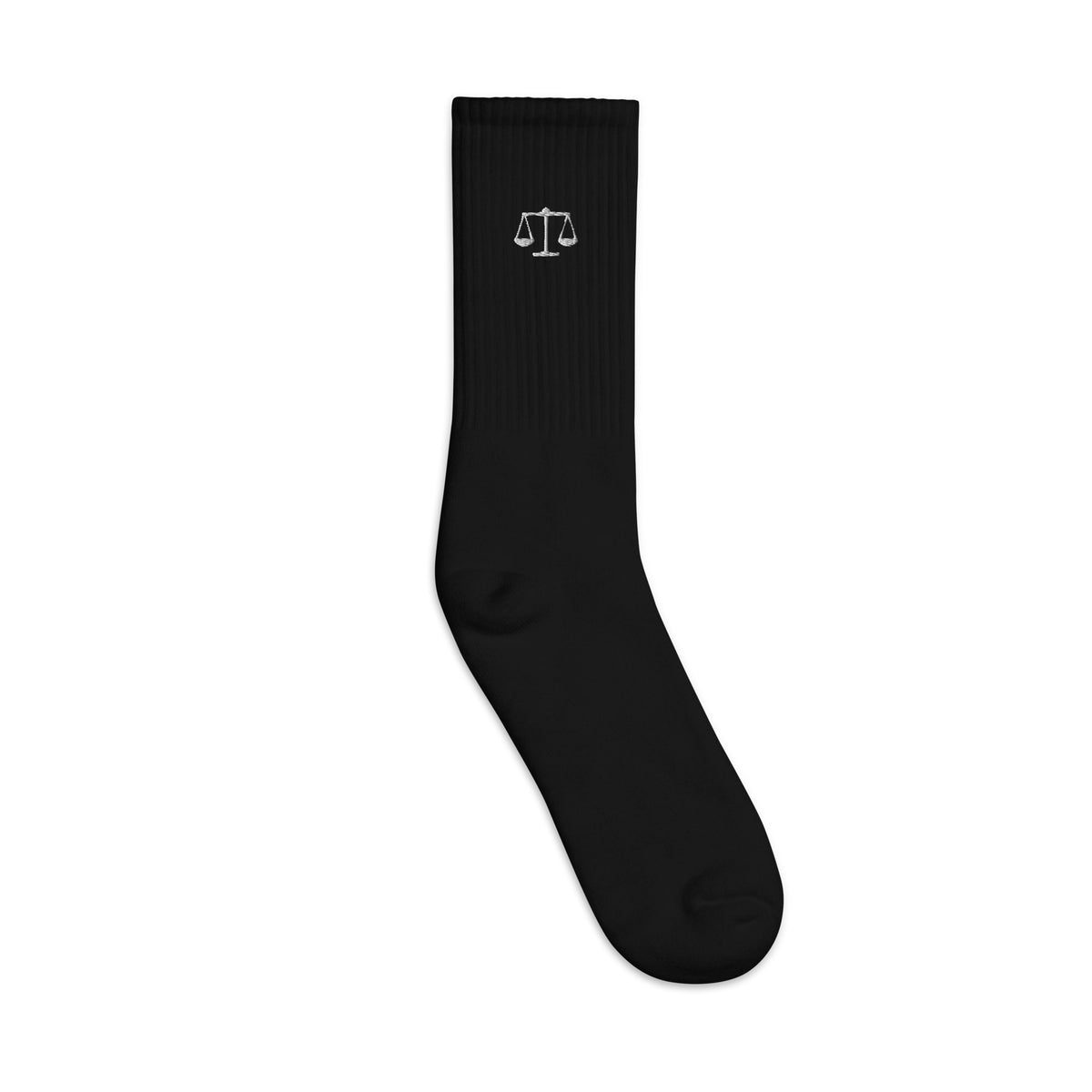 Black crew socks with embroidered Scales of Justice, outer side view